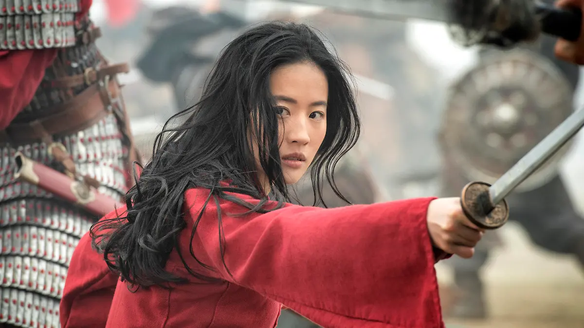 This image released by Disney shows Yifei Liu in the title role of "Mulan." (Jasin Boland/Disney via AP)