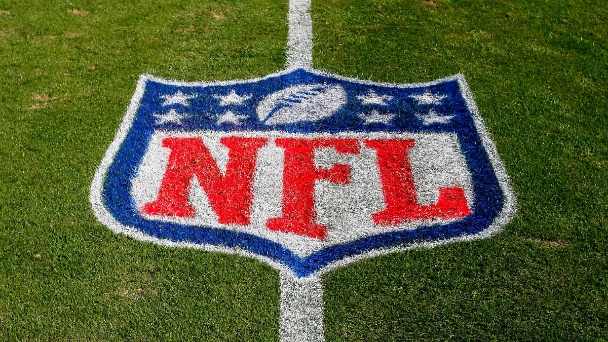 FILE - In this Nov. 4, 2018 file photo, the NFL logo is displayed on the field at the Bank of American Stadium before an NFL football game between the Tampa Bay Buccaneers and the Carolina Panthers in Charlotte, N.C. The NFL revealed Sunday, Aug. 23, 2020, that several positive COVID-19 tests were found a day earlier by one of its testing partners, and the Chicago Bears said they had nine false positives. (AP Photo/Nell Redmond, File)