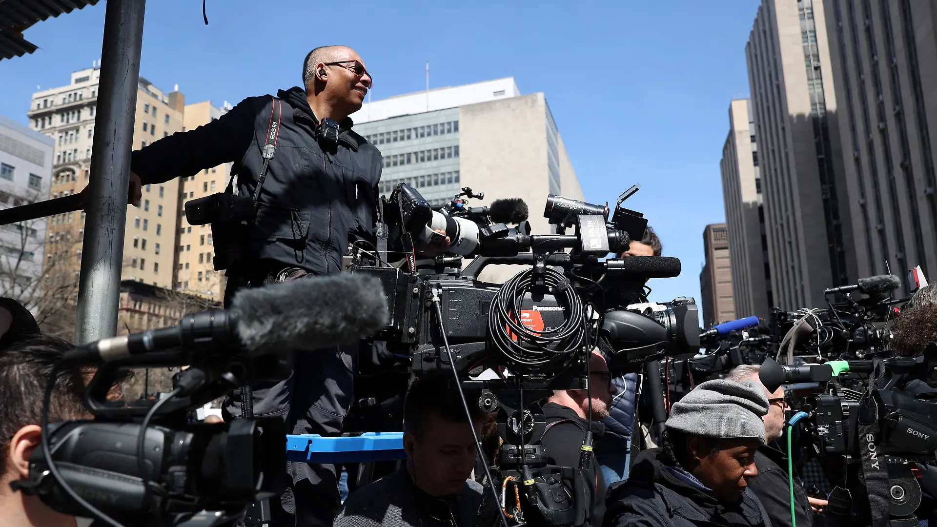 Members of the media gather outside Manhattan Criminal Courthouse on the day of former U.S. President Donald Trump's court appearance after his indictment by a Manhattan grand jury following a probe into hush money paid to porn star Stormy Daniels, in New York City, U.S., April 4, 2023. REUTERS/Caitlin Ochs