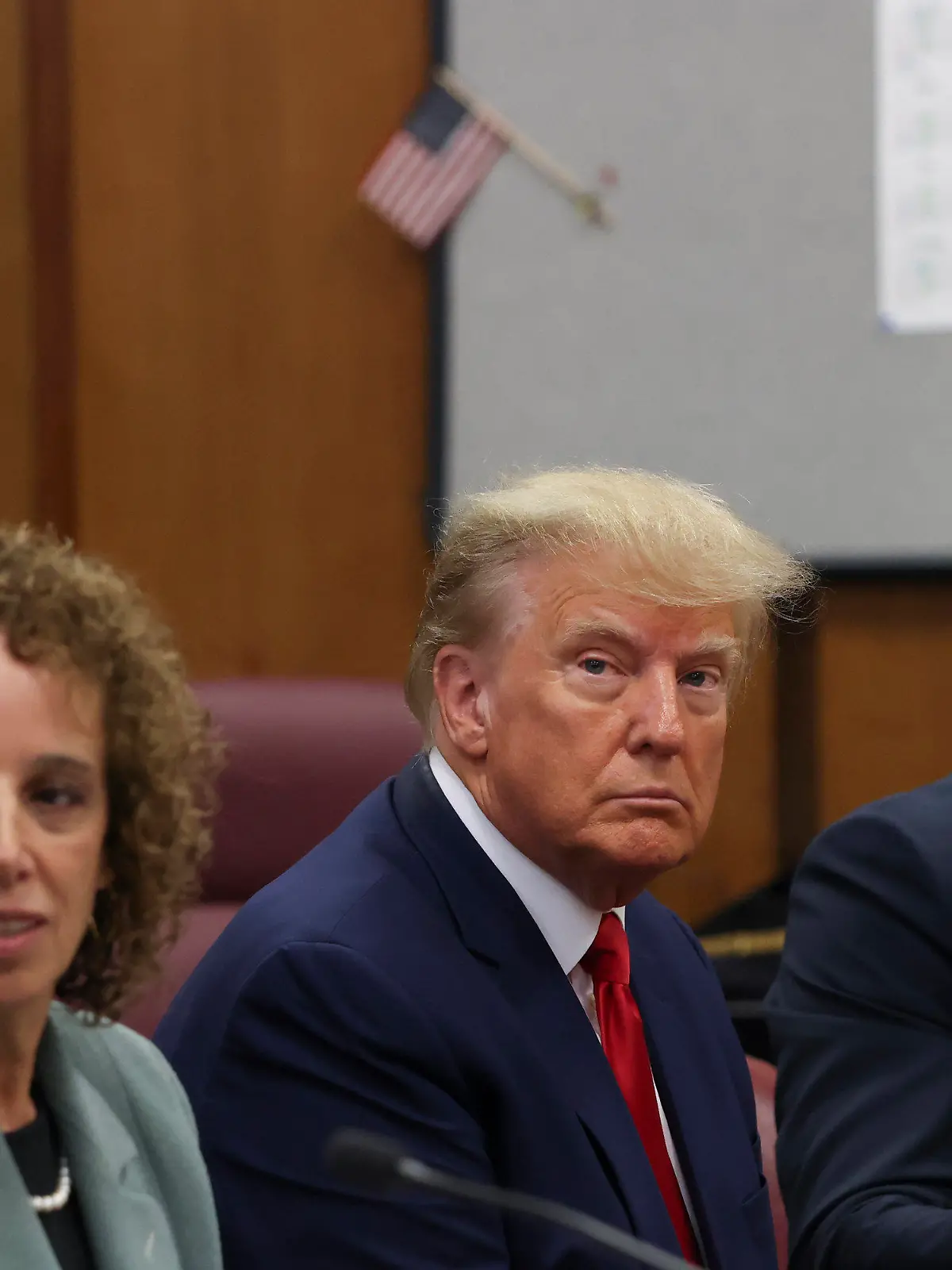 Former President Donald Trump appears in court for his arraignment, Tuesday, April 4, 2023, in New York.  Trump surrendered to authorities ahead of his arraignment on criminal charges stemming from a hush money payment to a porn actor during his 2016 campaign.  (Andrew Kelly/Pool Photo via AP)