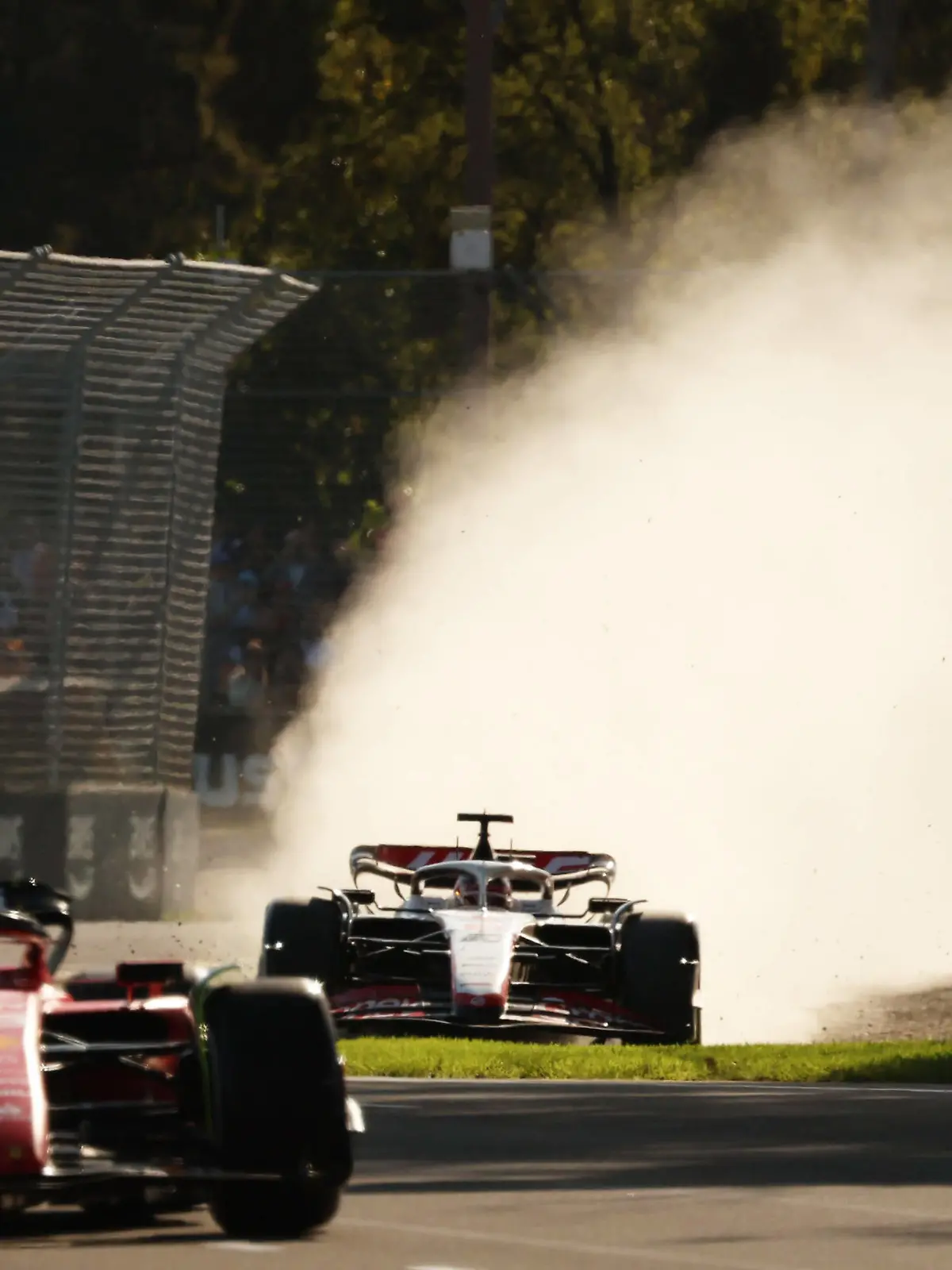 Formula 1 2023: Australian GP MELBOURNE GRAND PRIX CIRCUIT, AUSTRALIA - APRIL 02: Kevin Magnussen, Haas VF-23 leaves the track as he follows Carlos Sainz, Ferrari SF-23 during the Australian GP at Melbourne Grand Prix Circuit on Sunday April 02, 2023 in Melbourne, Australia. Photo by Mark Horsburgh rsburgh PUBLICATIONxINxGERxSUIxAUTxHUNxONLY _153444MH1_5841