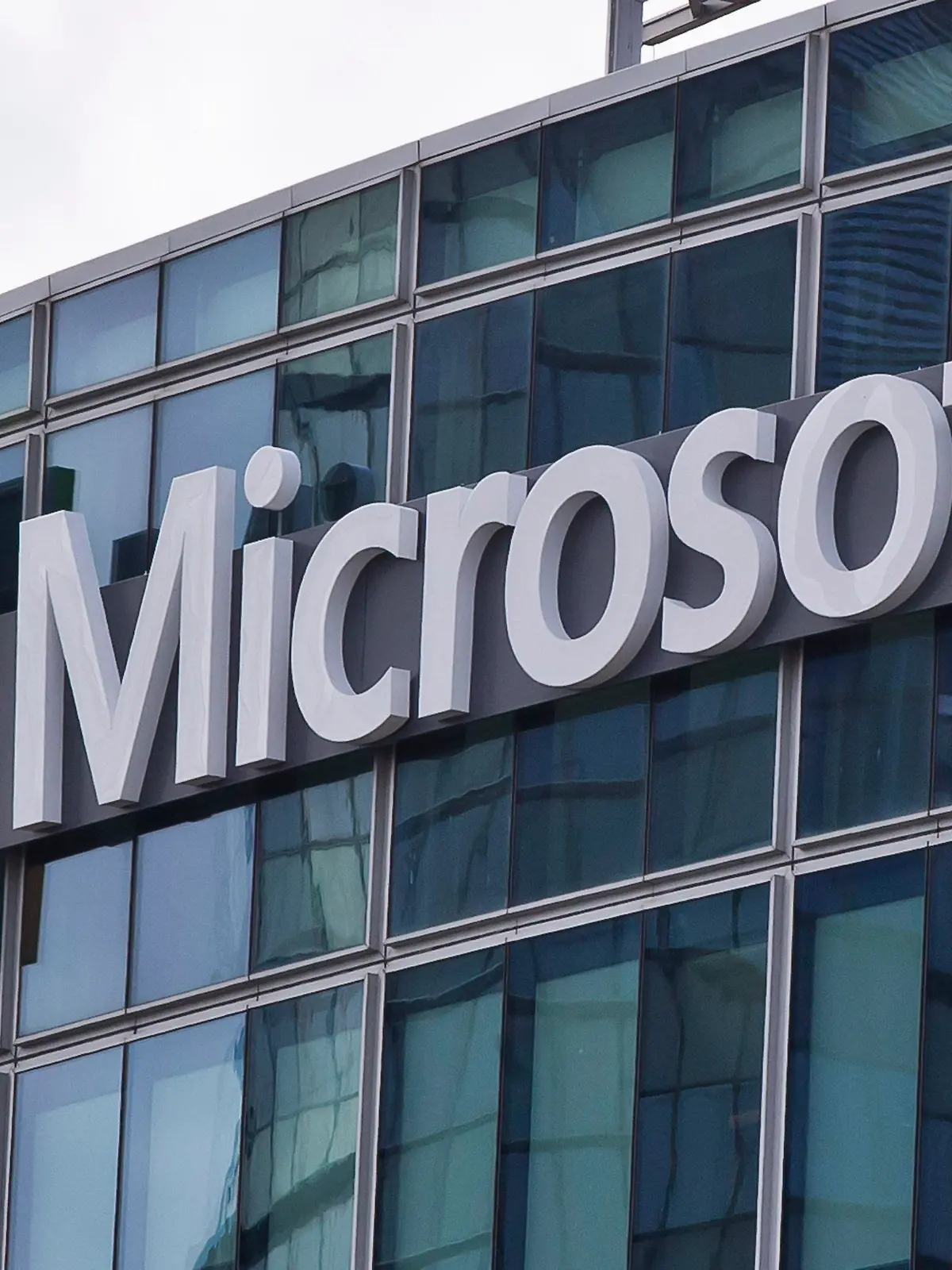 FILE - This April 12, 2016 file photo shows the Microsoft logo in Issy-les-Moulineaux, outside Paris, France. Ongoing demand for Microsoft's cloud computing services help softened the blow of the coronavirus pandemic on the software giant's other products during the first three months of the year. The company on Wednesday, April 29, 2020 reported fiscal third-quarter profit of $10.75 billion, up 22% from the same period last year. Net income of $1.40 per share beat Wall Street expectations of $1.27 a share. (AP Photo/Michel Euler, File)