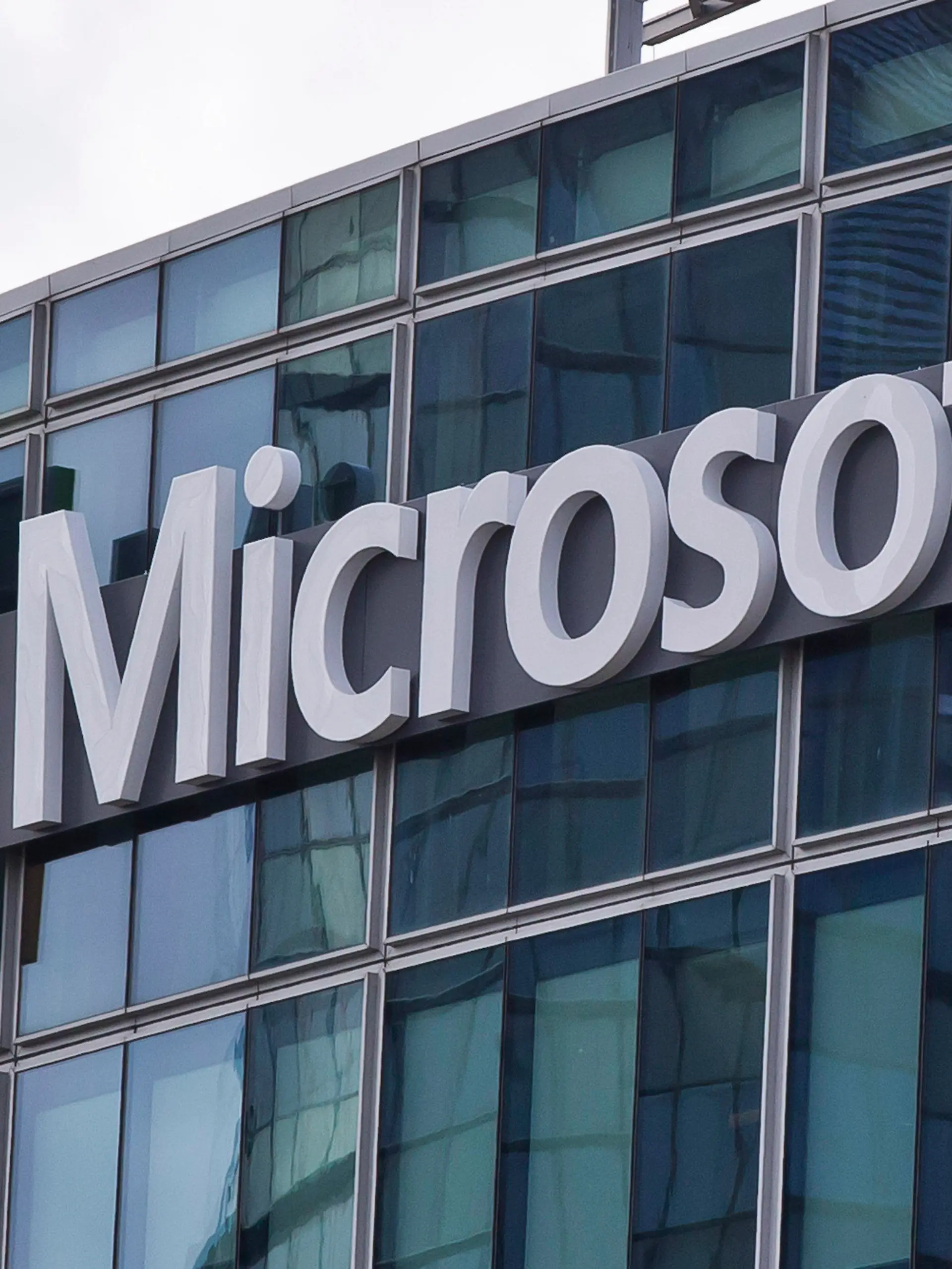 FILE - This April 12, 2016 file photo shows the Microsoft logo in Issy-les-Moulineaux, outside Paris, France. Ongoing demand for Microsoft's cloud computing services help softened the blow of the coronavirus pandemic on the software giant's other products during the first three months of the year. The company on Wednesday, April 29, 2020 reported fiscal third-quarter profit of $10.75 billion, up 22% from the same period last year. Net income of $1.40 per share beat Wall Street expectations of $1.27 a share. (AP Photo/Michel Euler, File)