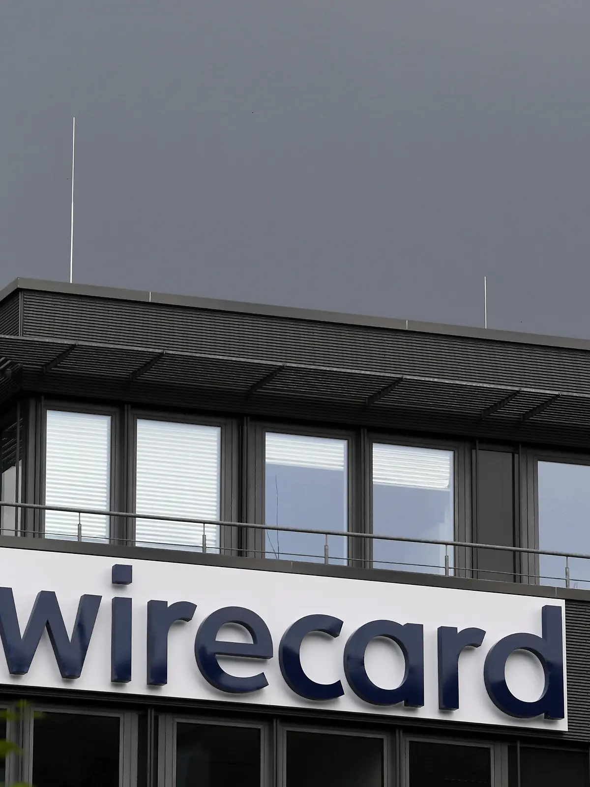 FILE PHOTO: The logo of Wirecard AG is pictured at its headquarters in Aschheim, near Munich, Germany, July 1, 2020. REUTERS/Andreas Gebert/File Photo  GLOBAL BUSINESS WEEK AHEAD