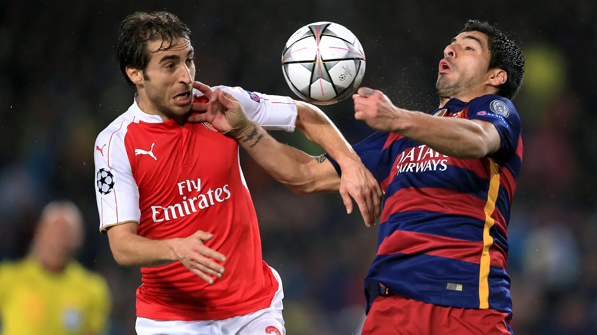 Barcelona v Arsenal - UEFA Champions League - Round of Sixteen - Second Leg - Camp Nou. Barcelona's Luis Suarez and Arsenal's Mathieu Flamini (left) battle for the ball URN:25847207