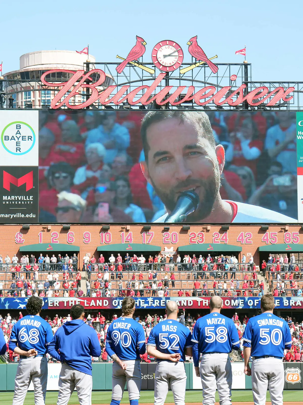 Toronto Blue Jays watch as St. Louis Cardinals injured pitcher Adam Wainwright sings the National Anthem before their game on Opening Day at Busch Stadium in St. Louis on Thursday, March 30, 2023. PUBLICATIONxINxGERxSUIxAUTxHUNxONLY SLP2023033011 BILLxGREENBLATT