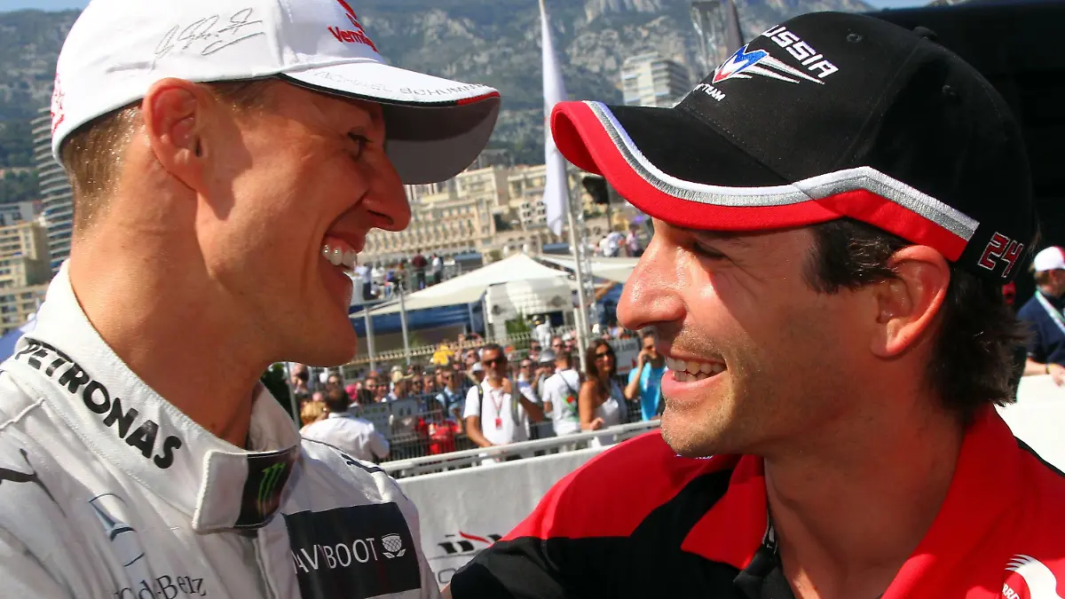 German Formula One driver Timo Glock (R) of Marussia congratulates German Formula One driver Michael Schumacher of Mercedes AMG (L)at the F1 race track of Monte Carlo, Monaco, 26 May 2012. Schumacher clocked the fastest time in the Qualifying session. The Grand Prix will take place on 27 May. Photo: Jens Buettner dpa +++(c) dpa - Bildfunk+++