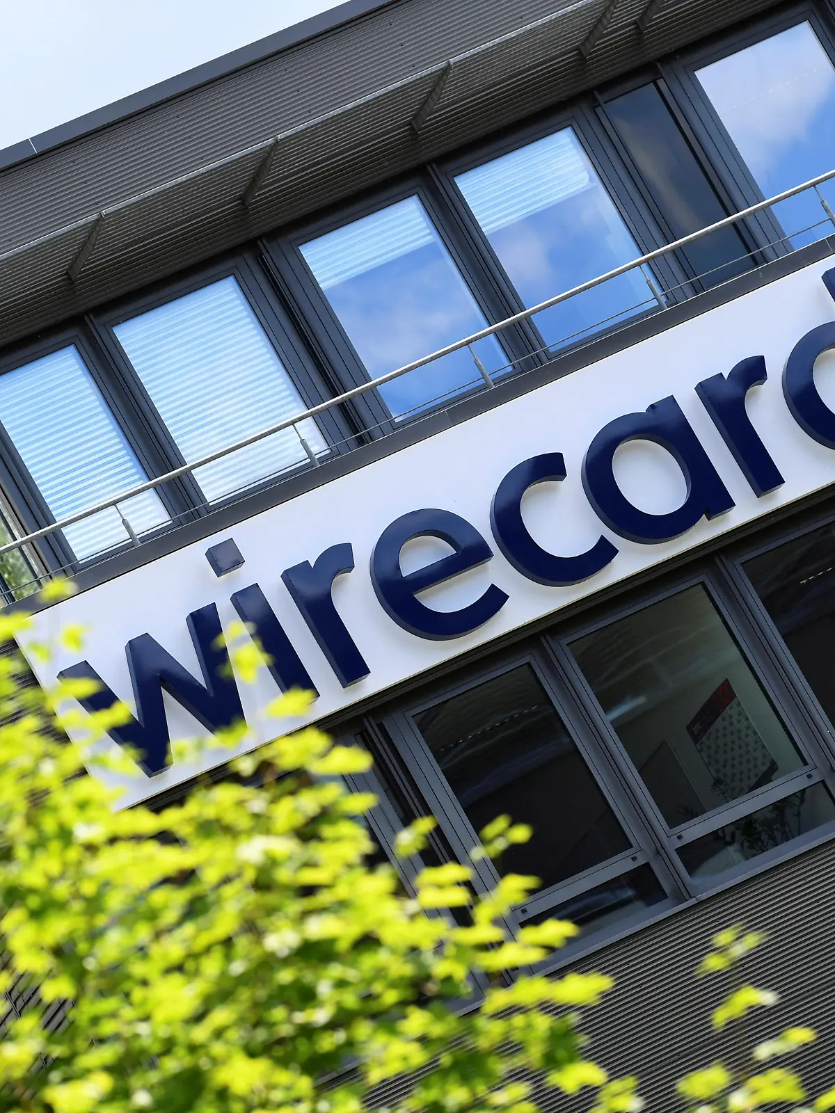 FILE PHOTO: The logo of Wirecard AG, an independent provider of outsourcing and white label solutions for electronic payment transactions, is pictured at its headquarters in Aschheim near Munich, Germany, July 1, 2020. REUTERS/Andreas Gebert/File Photo