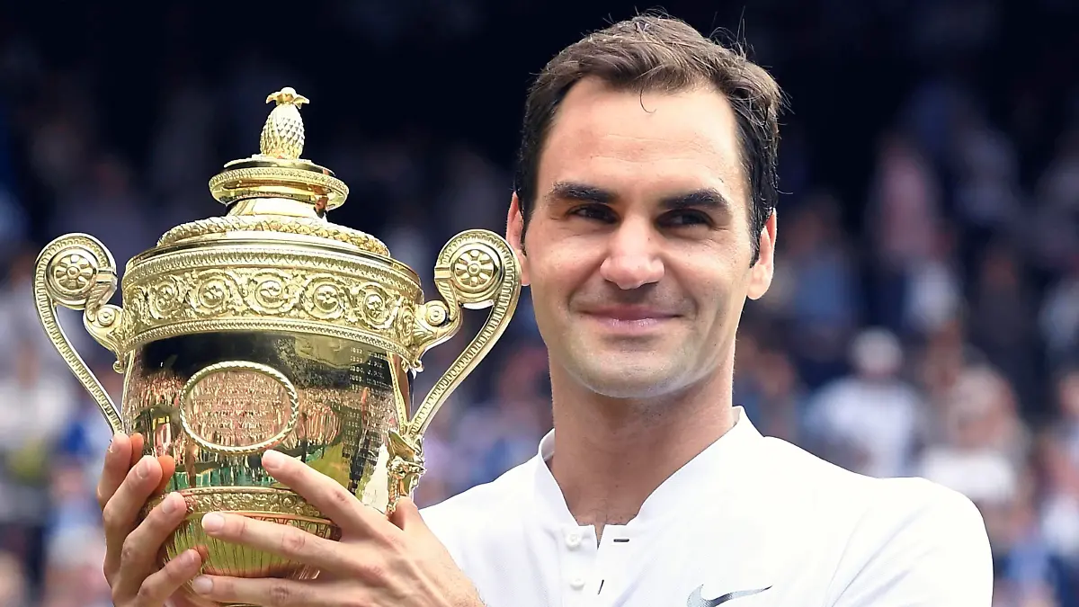 FILE: Roger Federer of Switzerland raises a victory trophy after winning the gentlemen's singles final of the Wimbledon tennis tournament against Marin Cilic of Croatia at All England Tennis Club in London on July 16, 2017. Former world number one in men's tennis Roger Federer announced his intention to retire. 41-year-old Roger Federer has claimed 20 Grand Slam titles.( The Yomiuri Shimbun via AP Images )