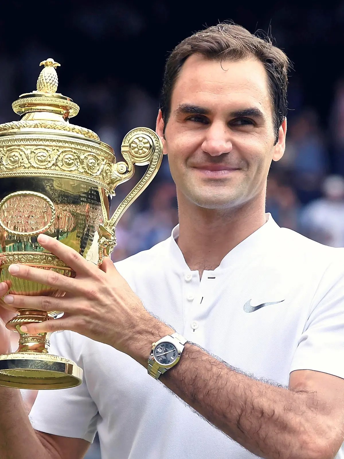 FILE: Roger Federer of Switzerland raises a victory trophy after winning the gentlemen's singles final of the Wimbledon tennis tournament against Marin Cilic of Croatia at All England Tennis Club in London on July 16, 2017. Former world number one in men's tennis Roger Federer announced his intention to retire. 41-year-old Roger Federer has claimed 20 Grand Slam titles.( The Yomiuri Shimbun via AP Images )