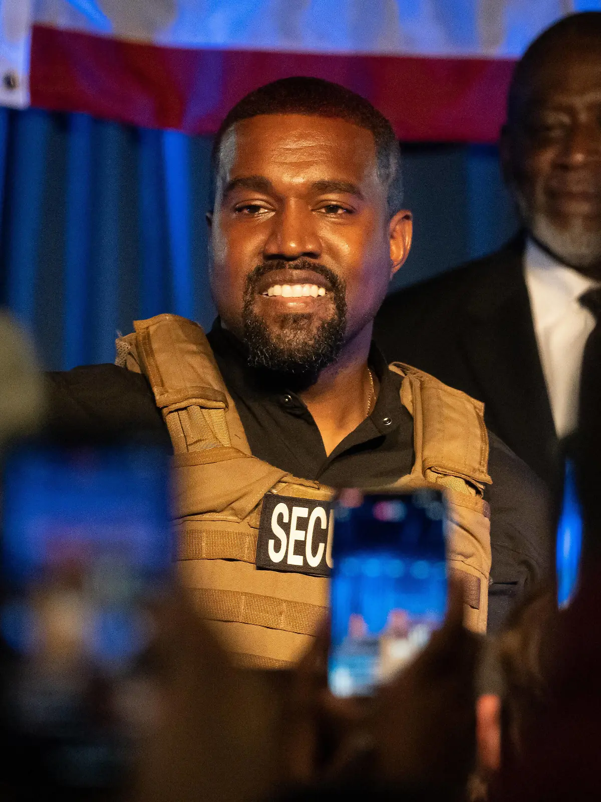 American rapper and entrepreneur Kanye West, wearing a bulletproof vest, addresses supporters during his first campaign event in the upcoming presidential election, Sunday, July 19 2020, in North Charleston, South Carolina. Kanye told the crowd that everyone that has a baby should get a million dollars and that marijuana should be free. PUBLICATIONxINxGERxSUIxAUTxHUNxONLY CHS20200719201 RICHARDxELLIS