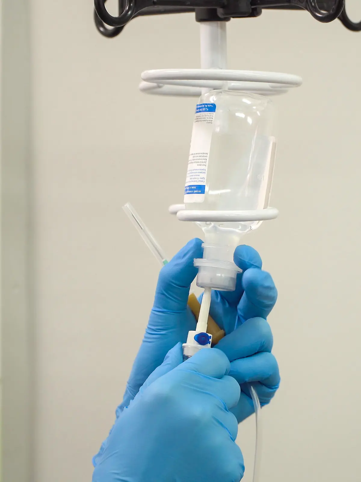 Doctor prepares the system with a dropper and a solution
