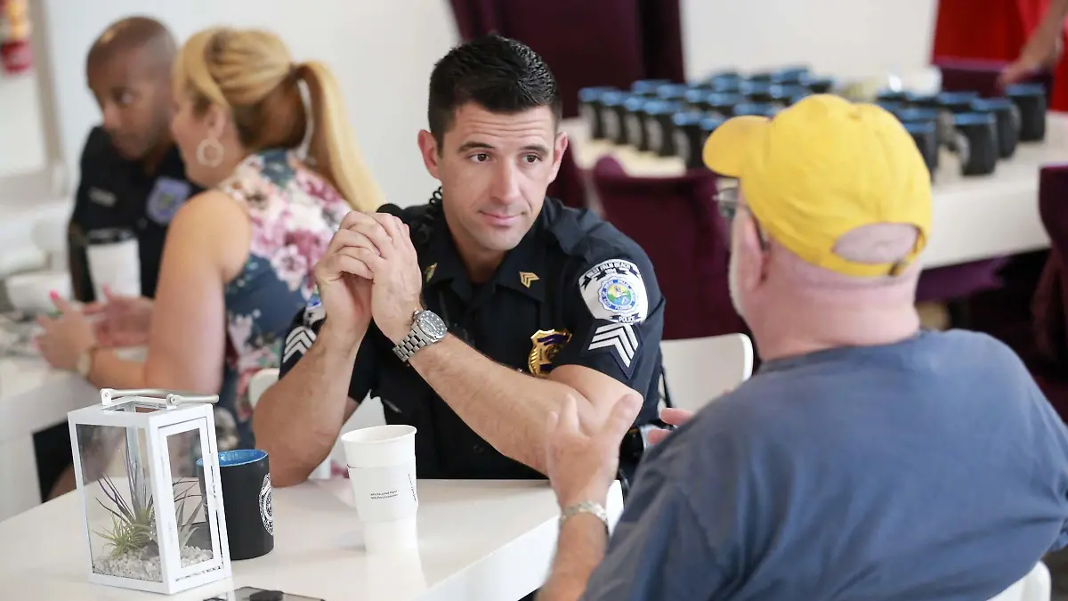 April 17, 2019 - Florida, U.S. - Residents interacted with West Palm Beach Police -- including Sergeant Joeseph Preusz (center) -- during Coffee with a Cop at Johan's Joe Wednesday morning, April 17, 2019 in West Palm Beach. (Credit Image: © Bruce R. Bennett/The Palm Beach Post via ZUMA Wire |