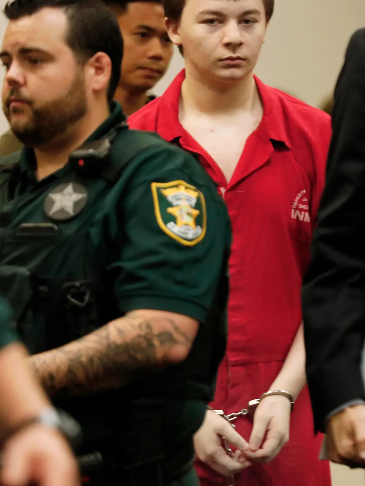 Aiden Fucci is led into the courtroom start his sentencing hearing, Friday, March 24, 2023. in St. Augustine, Fla. A Florida judge sentenced the 16-year-old Florida boy to life in prison on Friday for fatally stabbing a 13-year-old classmate on Mother's Day in 2021. Fucci, who pleaded guilty just before his trial was set to start in February, was not eligible for the death penalty. (Bob Self/The Florida Times-Union via AP)