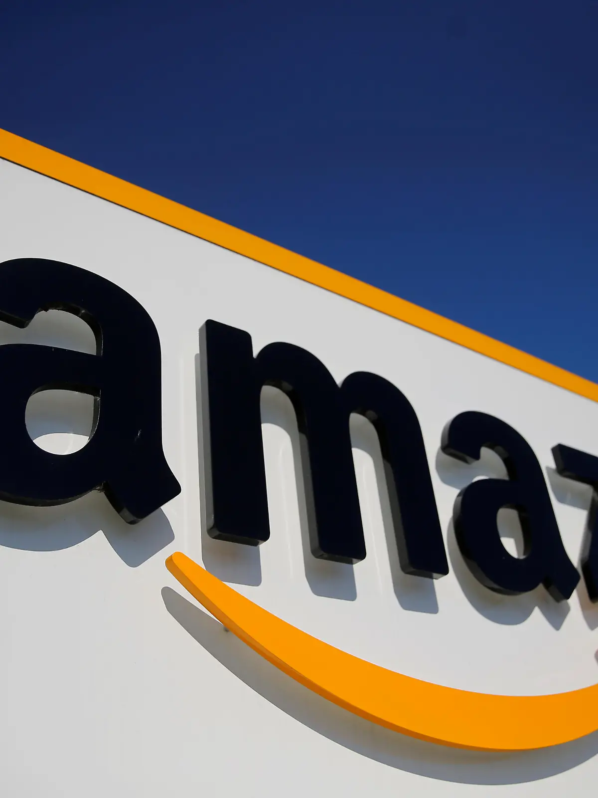 FILE PHOTO: The logo of Amazon is seen at the company logistics center in Lauwin-Planque, northern France, April 22, 2020 after Amazon extended the closure of its French warehouses until April 25 included, following dispute with unions over health protection measures amid the coronavirus disease (COVID-19) outbreak.  REUTERS/Pascal Rossignol/File Photo
