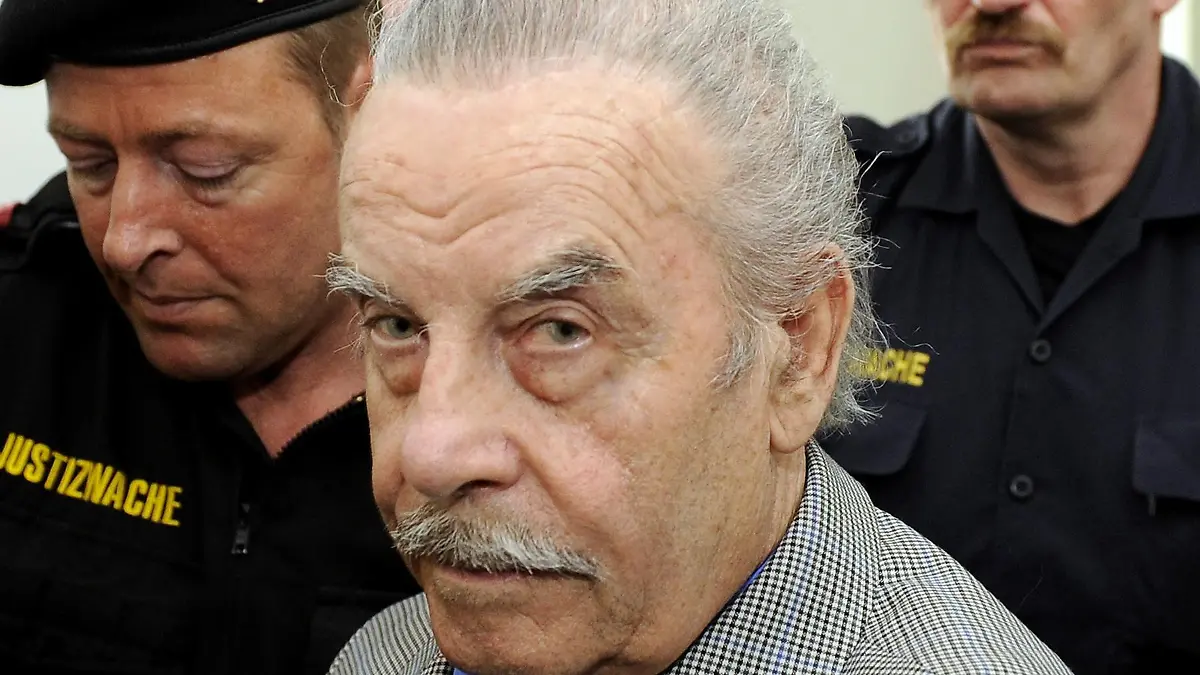 Defendant Josef Fritzl, center, is escorted to the fourth day of his trial in the provincial courthouse in St. Poelten, Austria, on Thursday, March 19, 2009. In a stunning turn of events the 73-year-old who fathered seven children with a daughter he held captive in a squalid cellar for 24 years, pleaded guilty on Wednesday to all charges against him after hearing his daughter's recorded testimony. The verdicts and sentences are expected Thursday afternoon. Fritzl faces up to life imprisonment. (AP Photo/Robert Jaeger, Pool) ** EDITORIAL USE ONLY **