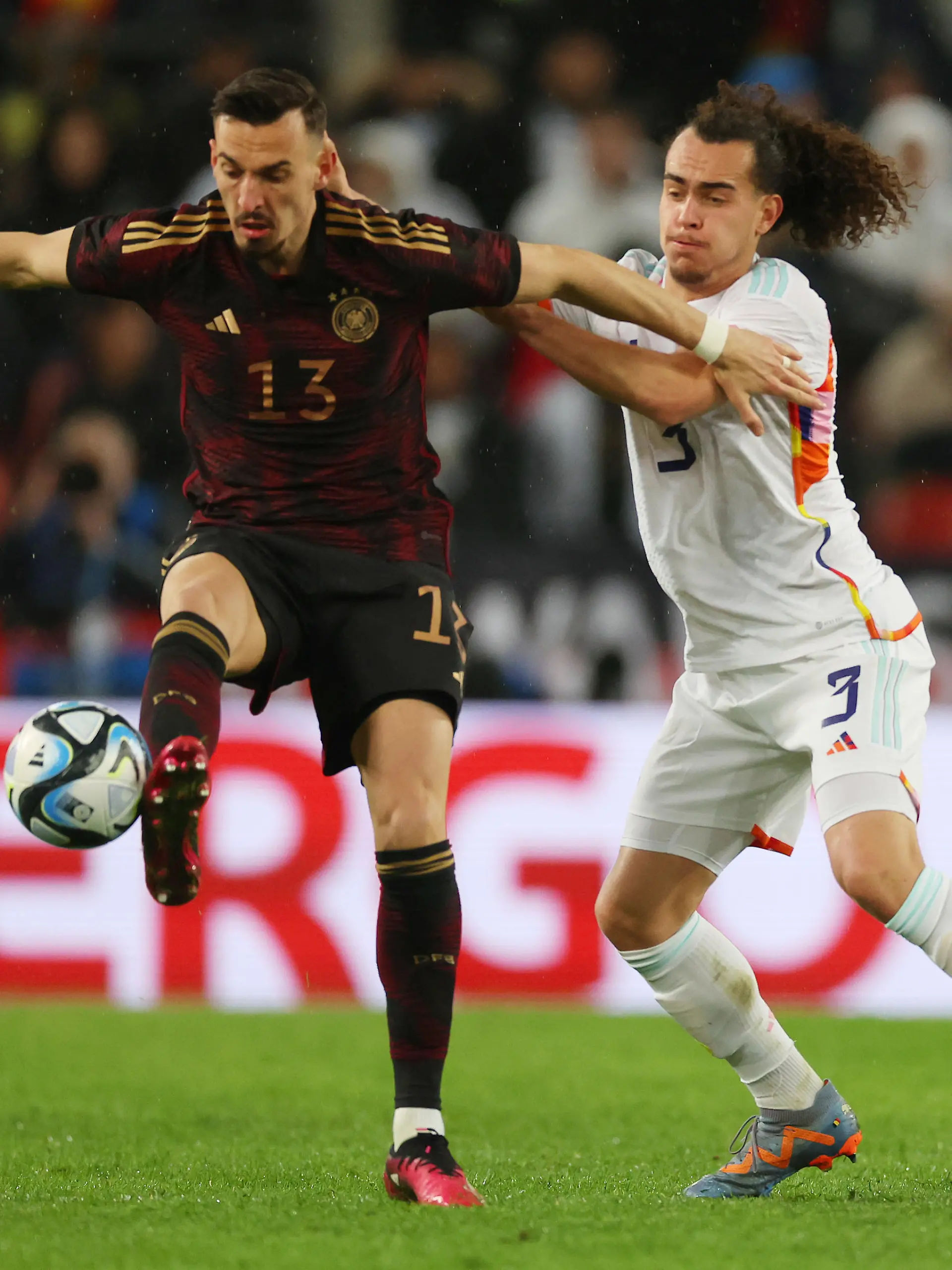 COLOGNE, GERMANY - MARCH 28: Mergim Berisha of Germany battles for possession with Arthur Theate of Belgium during the international friendly match between Germany and Belgium at RheinEnergieStadion on March 28, 2023 in Cologne, Germany. (Photo by Alexander Hassenstein/Getty Images)