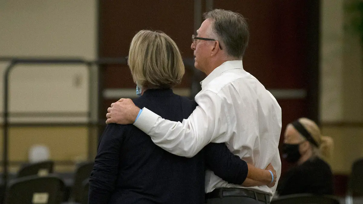 Gay and Bob Hardwick who were attacked in their Stockton home in 1978 by Golden State Killer, Joseph James DeAngelo, stand as the charges are read against DeAngelo during a hearing in Sacramento Superior Court in Sacramento, Calif. Monday June 29, 2020. DeAngelo, 74, pleaded guilty to 13 counts of murder and multiple other charges 40 years after a sadistic series of assaults and slayings in California. (AP Photo/Rich Pedroncelli)