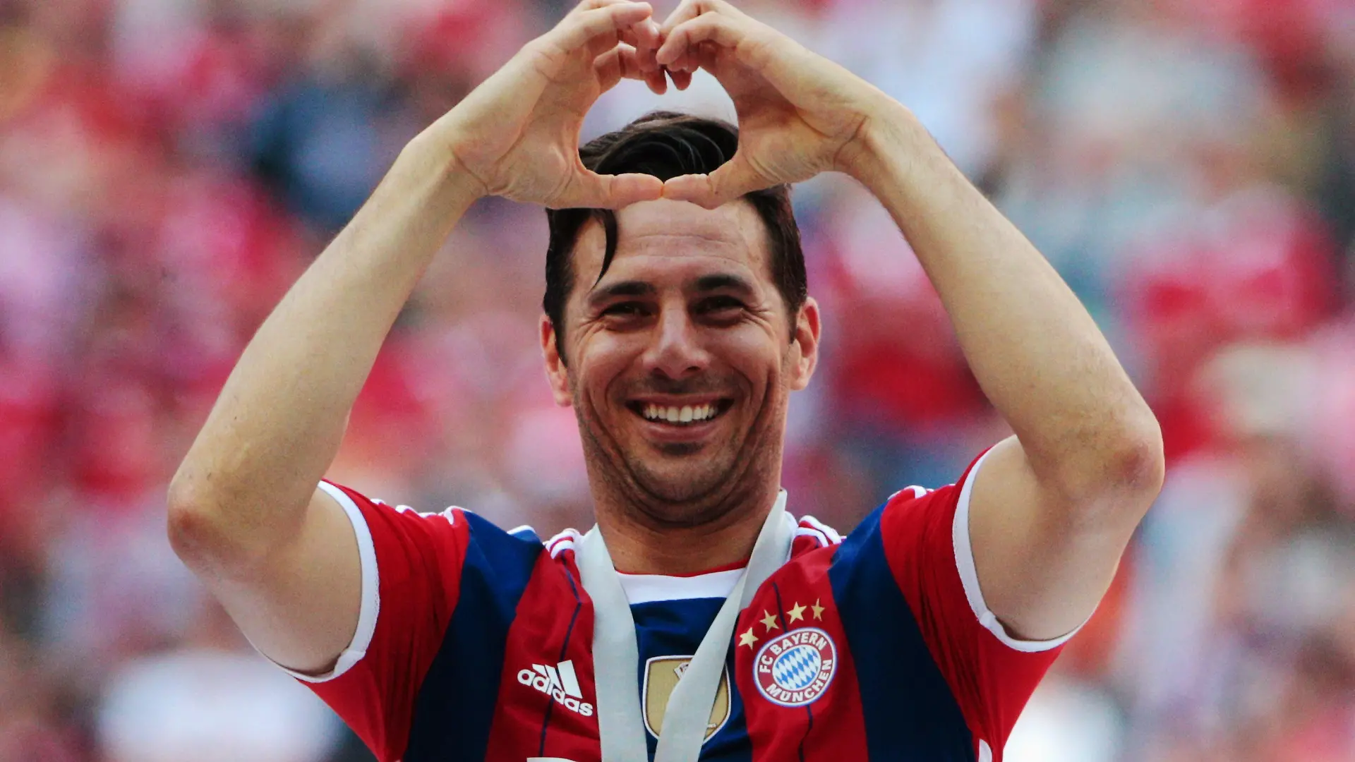 MUNICH, GERMANY - MAY 10: Claudio Pizarro celebrates with his Bundesliga champions medal after the Bundesliga match between Bayern Muenchen and VfB Stuttgart at Allianz Arena on May 10, 2014 in Munich, Germany. (Photo by Adam Pretty/Bongarts/Getty Images)