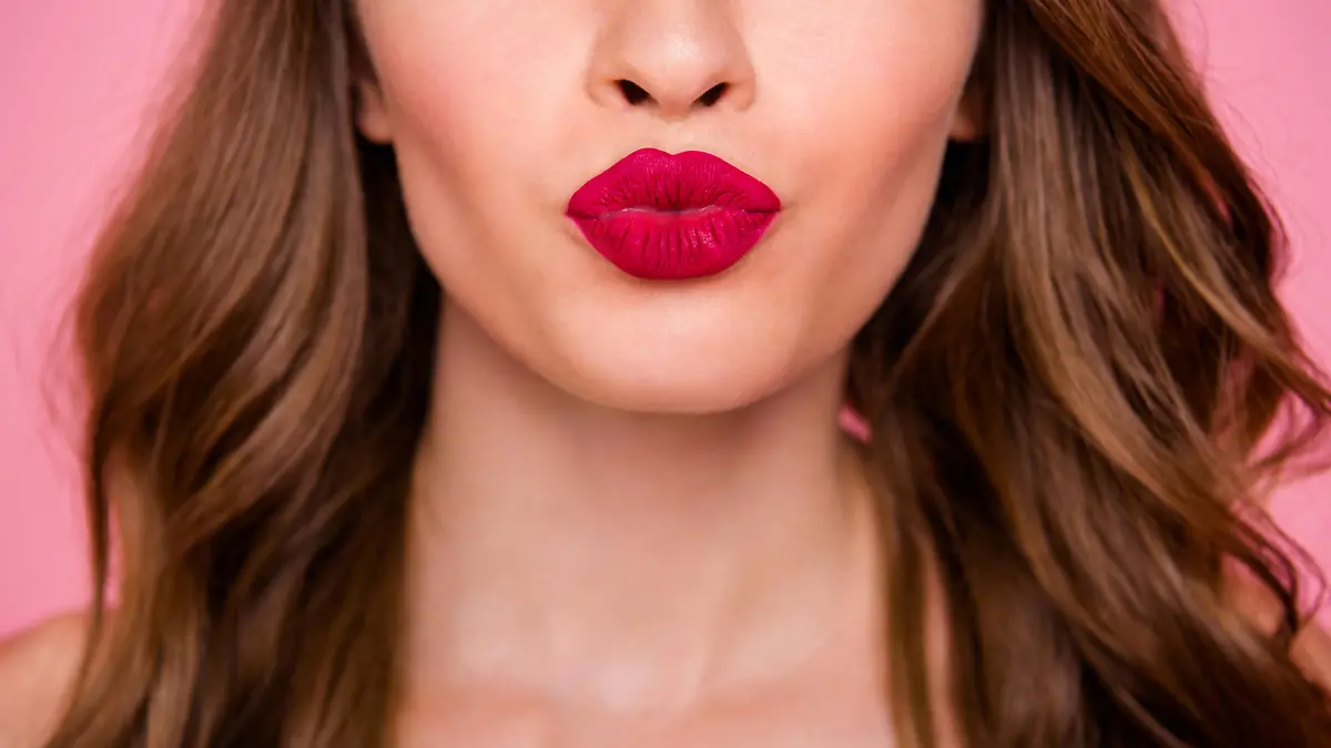 Cropped close up photo amazing beautiful she her lady attractive show ideal plump rose lips pomade lipstick hide eyes wear cute shiny colorful dress isolated pink rose bright vivid background.