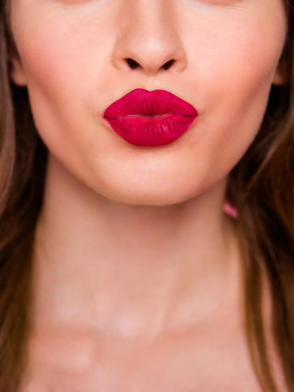 Cropped close up photo amazing beautiful she her lady attractive show ideal plump rose lips pomade lipstick hide eyes wear cute shiny colorful dress isolated pink rose bright vivid background.