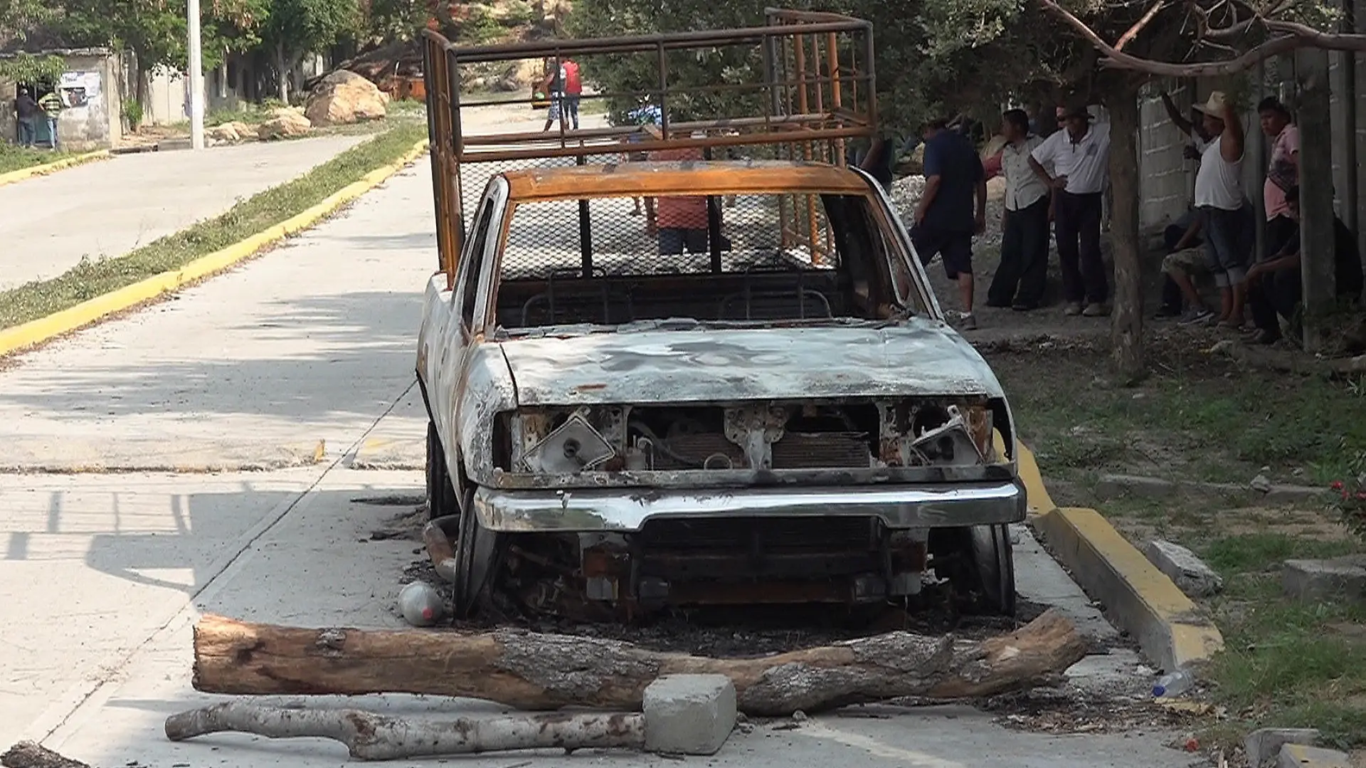 The burnt wreckage of a truck lies on a street after assailants killed 15 inhabitants of an indigenous village, that has been plagued by local disputes, in San Mateo del Mar, in Oaxaca state, Mexico June 22, 2020. REUTERS/Jose de Jesus Cortes