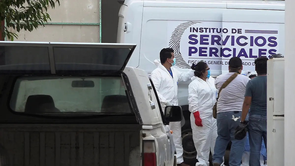 Forensic technicians are pictured outside a funeral parlor after transporting the bodies of inhabitants of an indigenous village killed by assailants, in an area that has been plagued by local disputes, in Salina Cruz, in Oaxaca state, Mexico June 22, 2020. REUTERS/Jose de Jesus Cortes