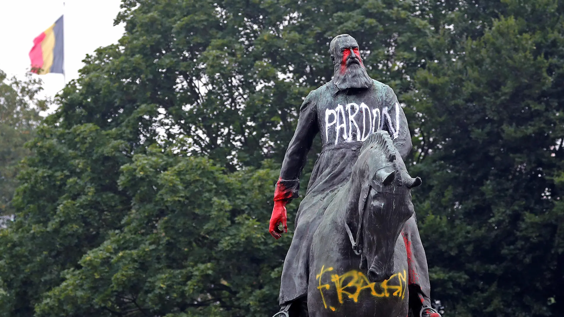 A statue of former Belgian King Leopold II, a controversial figure in the history of Belgium, is seen sprayed with graffiti in Brussels, Belgium June 11, 2020. REUTERS/Yves Herman