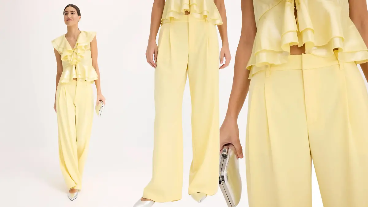 Model trägt die hellgelbe Marlenehose von Bonprix.