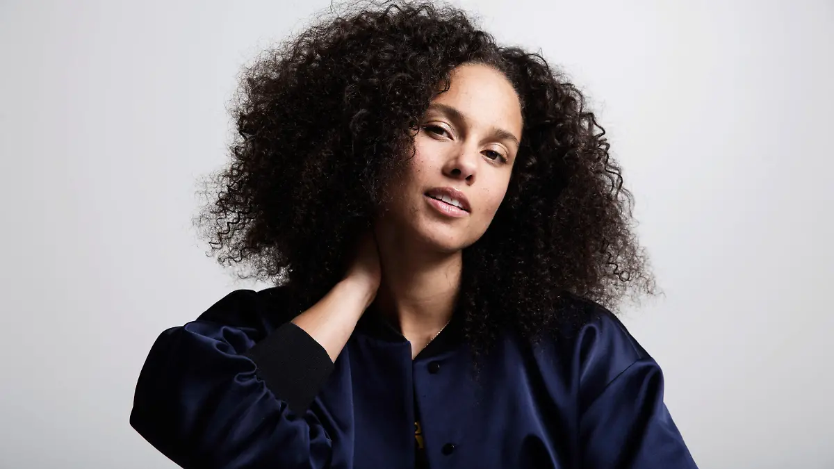 FILE - In this Nov. 2, 2016 file photo, Alicia Keys poses for a portrait in New York. Keys' memoir "More Myself" with be released on Tuesday, March 31. (Photo by Taylor Jewell/Invision/AP, File)