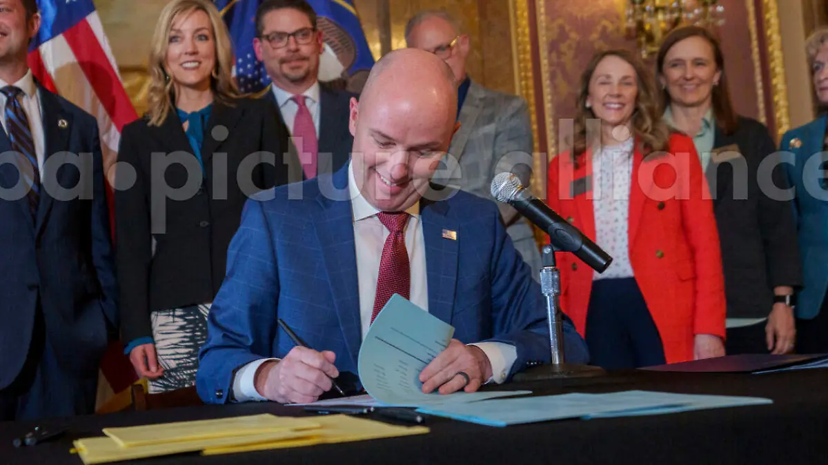 Gov. Spencer Cox signs two social media regulation bills during a ceremony at the Capitol building in Salt Lake City on Thursday, March 23, 2023. Cox signed a pair of measures that aim to limit when and where children can use social media and stop companies from luring kids to the sites. (Trent Nelson/The Salt Lake Tribune via AP)