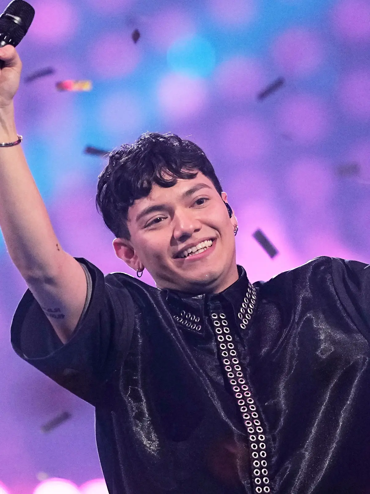 Winner of the Eurovision Song Contest JJ from Austria holds up the trophy onstage, he won with the song „Wasted Love” during the Grand Final of the 69th Eurovision Song Contest, in Basel, Switzerland, Saturday, May 17, 2025. (AP Photo/Martin Meissner)