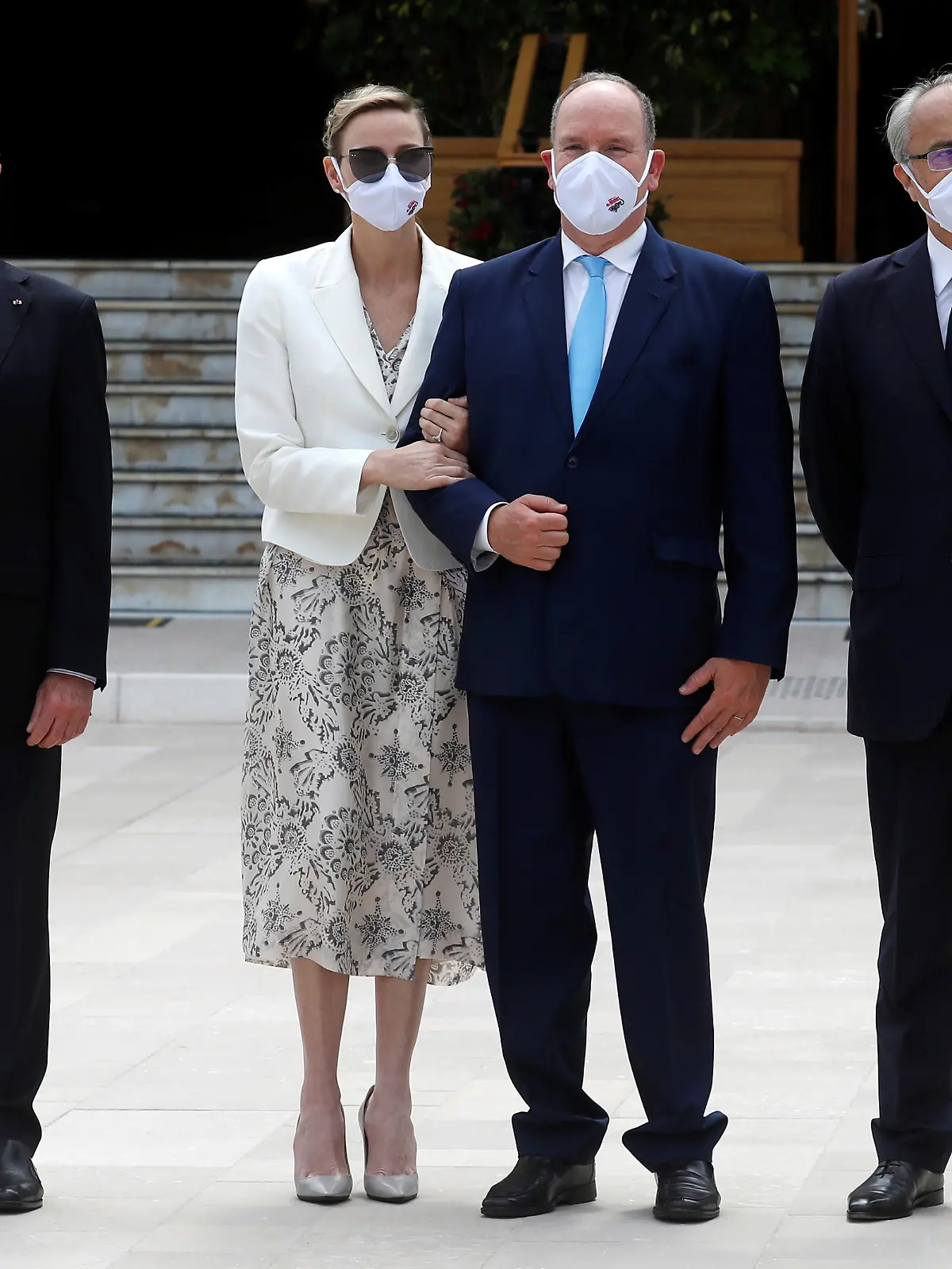 Prince Albert II of Monaco and his wife Princess Charlene, wearing protective face masks, pose with Monaco State Minister Serge Telle and Jean Luc Biamonti, Delegate President of Societe des Bains de Mer (SBM), during attend the inauguration of the new Casino square in Monte Carlo, following the coronavirus disease (COVID-19) outbreak in Monaco June 2, 2020. REUTERS/Eric Gaillard