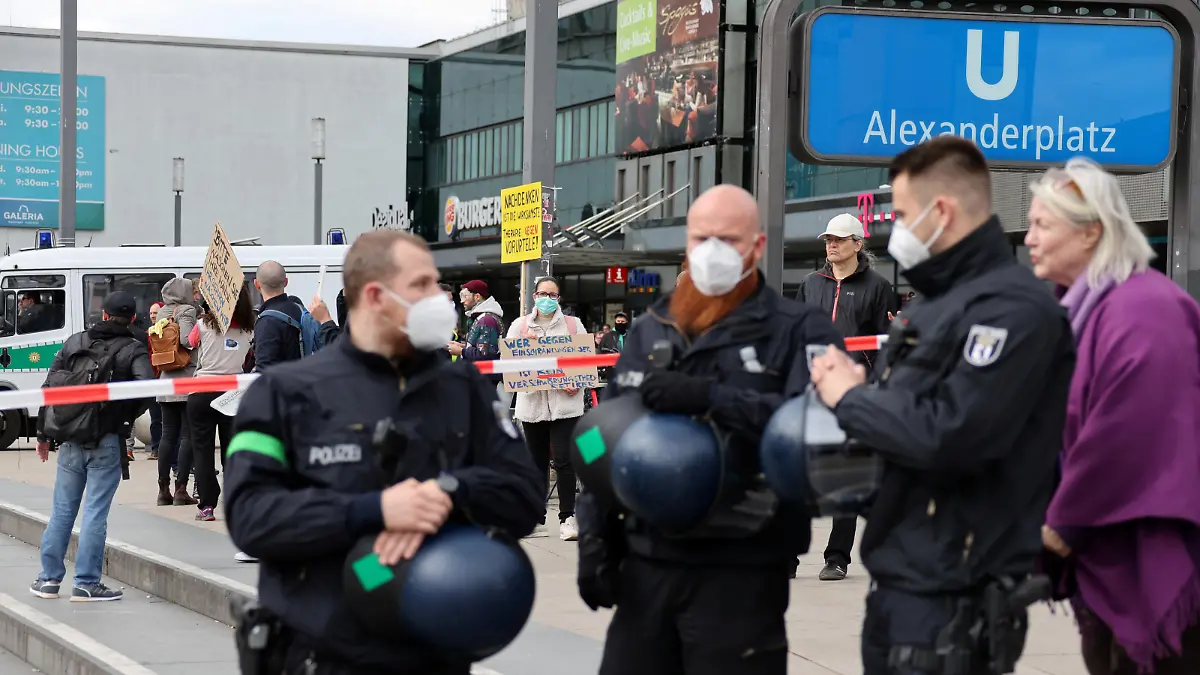 Police officers wearing face masks gather during a protest against the government's restrictions following the coronavirus disease (COVID-19) outbreak, at Alexanderplatz square in Berlin, Germany, May 16, 2020. REUTERS/Fabrizio Bensch