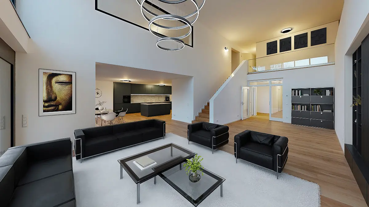 Wohnungsbereich einer der Wohnungen mit schwarzen Polstermöbeln und Glastischen auf Laminat, dazu ein weißer Teppich und ein Küchenbereich im Hintergrund.