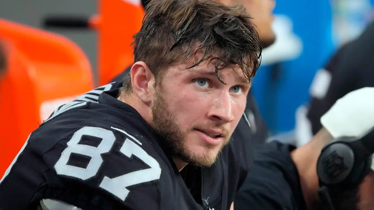 FILE -Las Vegas Raiders tight end Foster Moreau (87) watches from the sideline during the first half of an NFL football game against the Kansas City Chiefs, Saturday, Jan. 7, 2023, in Las Vegas. NFL free-agent tight end Foster Moreau was diagnosed with Hodgkin’s lymphoma during a physical with the New Orleans Saints, he posted Wednesday, March 22, 2023 on Twitter.(AP Photo/Rick Scuteri, File)
