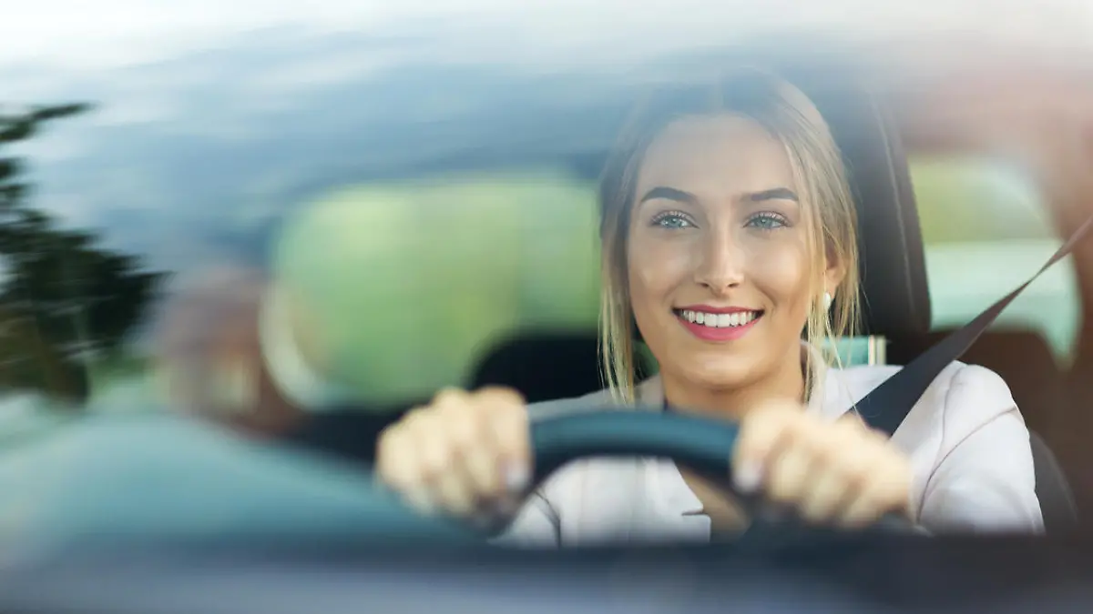 Young woman sitting in a car