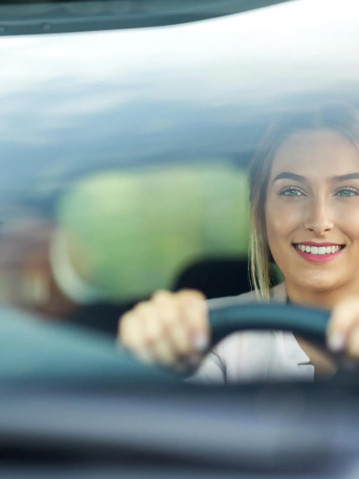 Young woman sitting in a car