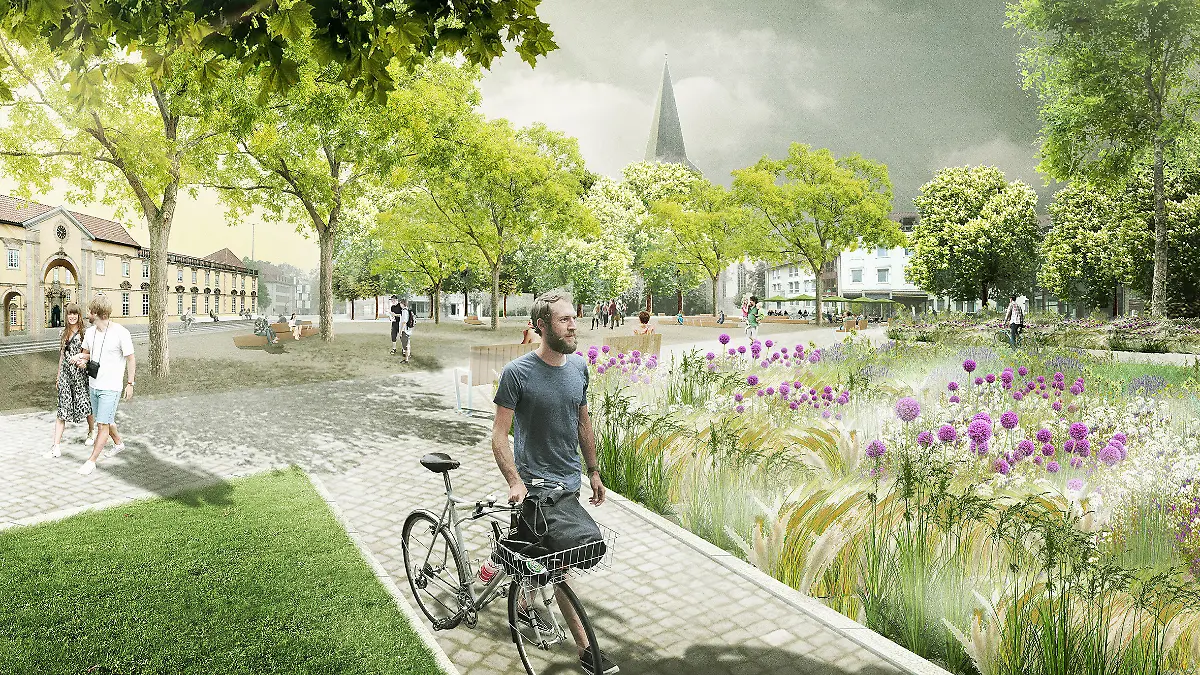 Der Platz am Ledenhof mit viel grün, einer Blumenwiese und Bänken