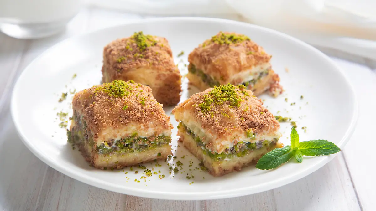 Traditional turkish new dessert cold milky baklava with pistachio (Turkish name; soguk baklava)
