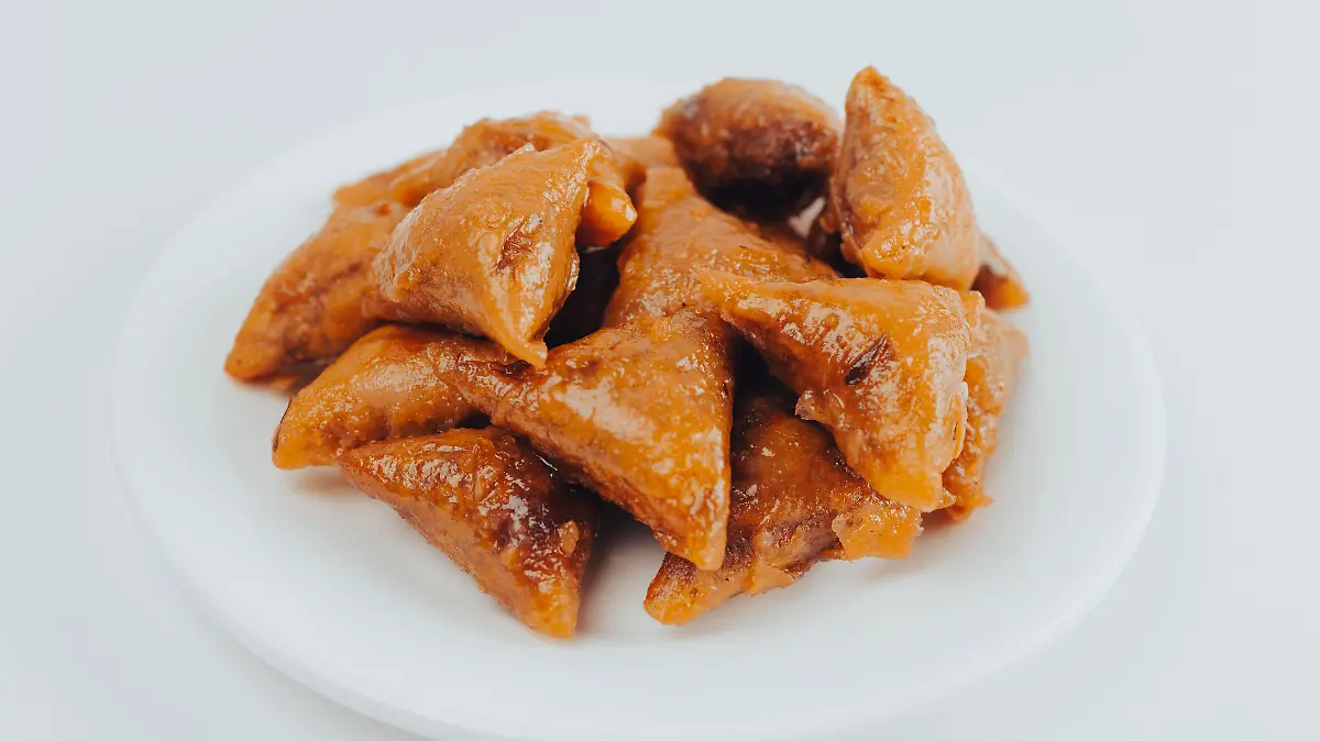 close up of Moroccan Almond Briouats Served in plat - A briouat or briwat is a sweet or savory puff pastry.