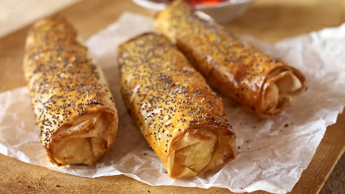 Rolled pastry boreks on a table setting