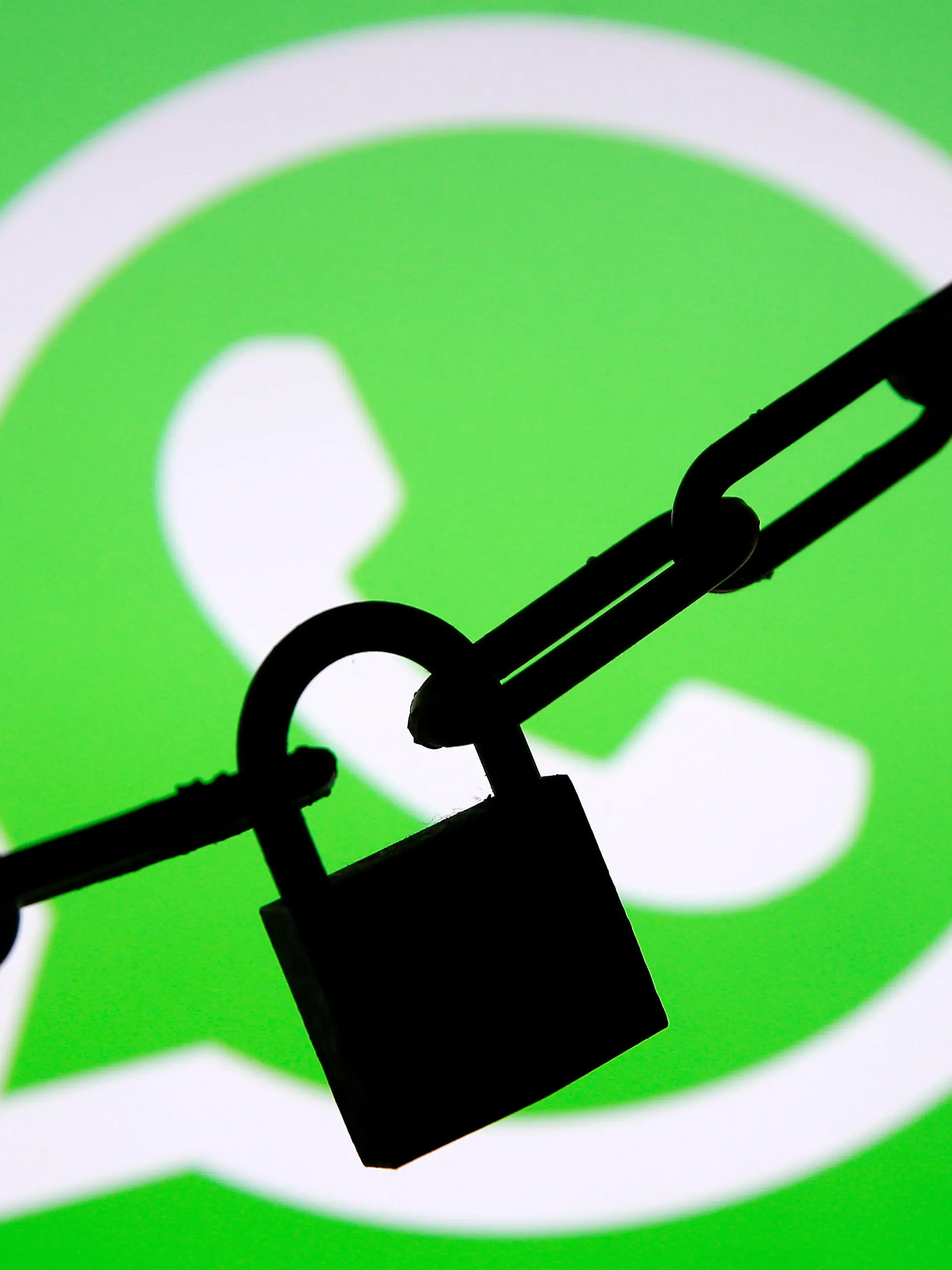 FILE PHOTO: A photo illustration shows a chain and a padlock in front of a displayed Whatsapp logo January 13, 2017. REUTERS/Dado Ruvic/Illustration/File Photo