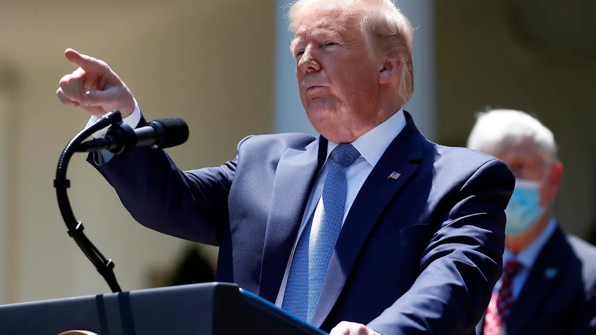 President Donald Trump answers questions during a press briefing about the coronavirus in the Rose Garden of the White House, Friday, May 15, 2020, in Washington. (AP Photo/Alex Brandon)