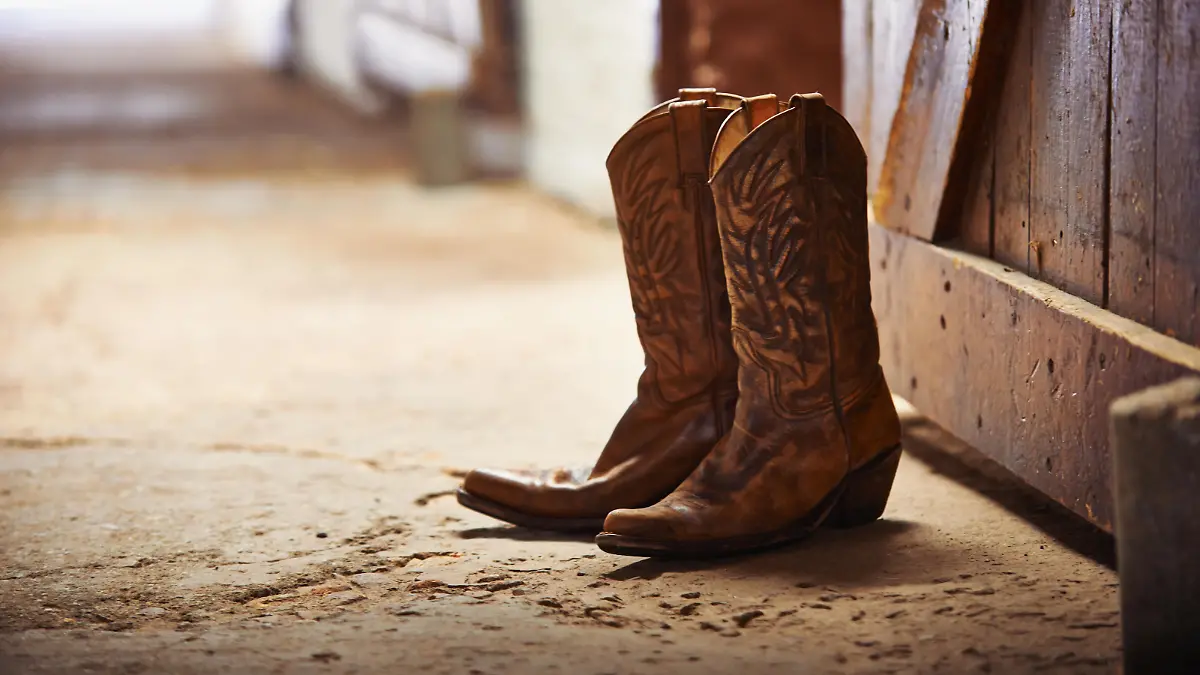 Shot of a pair of cowboy boots in a barn