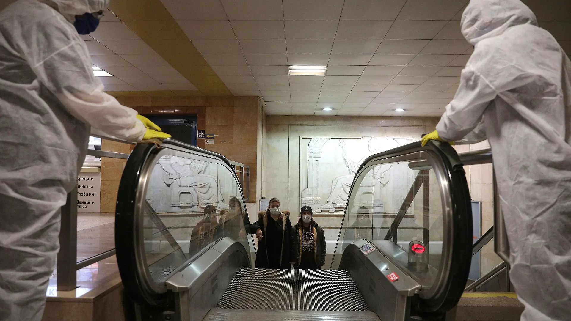 FILE PHOTO: Workers disinfect an escalator in Serdika metro station, following the outbreak of the coronavirus disease (COVID-19), Sofia, Bulgaria, April 8, 2020. REUTERS/Stoyan Nenov/File Photo
