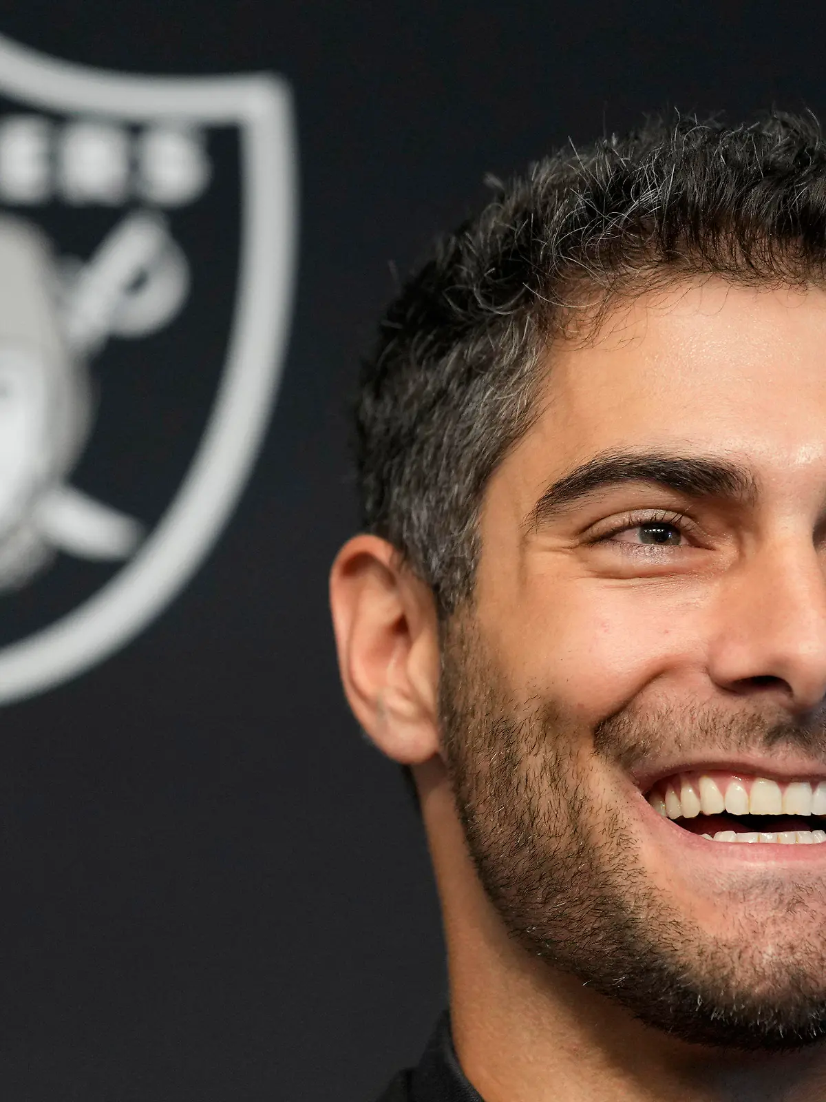 Las Vegas Raiders quarterback Jimmy Garoppolo takes questions at an NFL football news conference Friday, March 17, 2023, in Henderson, Nev. (AP Photo/John Locher)