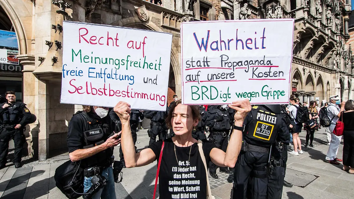  May 9, 2020, Munich, Bavaria, Germany: Despite ongoing relaxing measures, a  Querfront cross-front mixture of 3,000 conspiracy theorists, QAnon followers, left-extremists, right-extremists, and Widerstand2020 assembled for a third weekend in Munich s city center, primarily at Marienplatz, to demonstrate for restoration of the Grundgesetz amid the Coronavirus crisis. Such demos and daily mini-demos with an overwhelming 2015-2016 Pegida quality are being staged throughout Germany, with two attacks on journalists for ARD and ZDF having taken place. Internally, members of the official Munich chat group have been planning attacks on journalists for the past week, with many of the more active members coming from right-extremist and neonazi circles and designating all journalists as oeantifa. - ZUMAb160 20200509zbpb160104 Copyright: xSachellexBabbarx