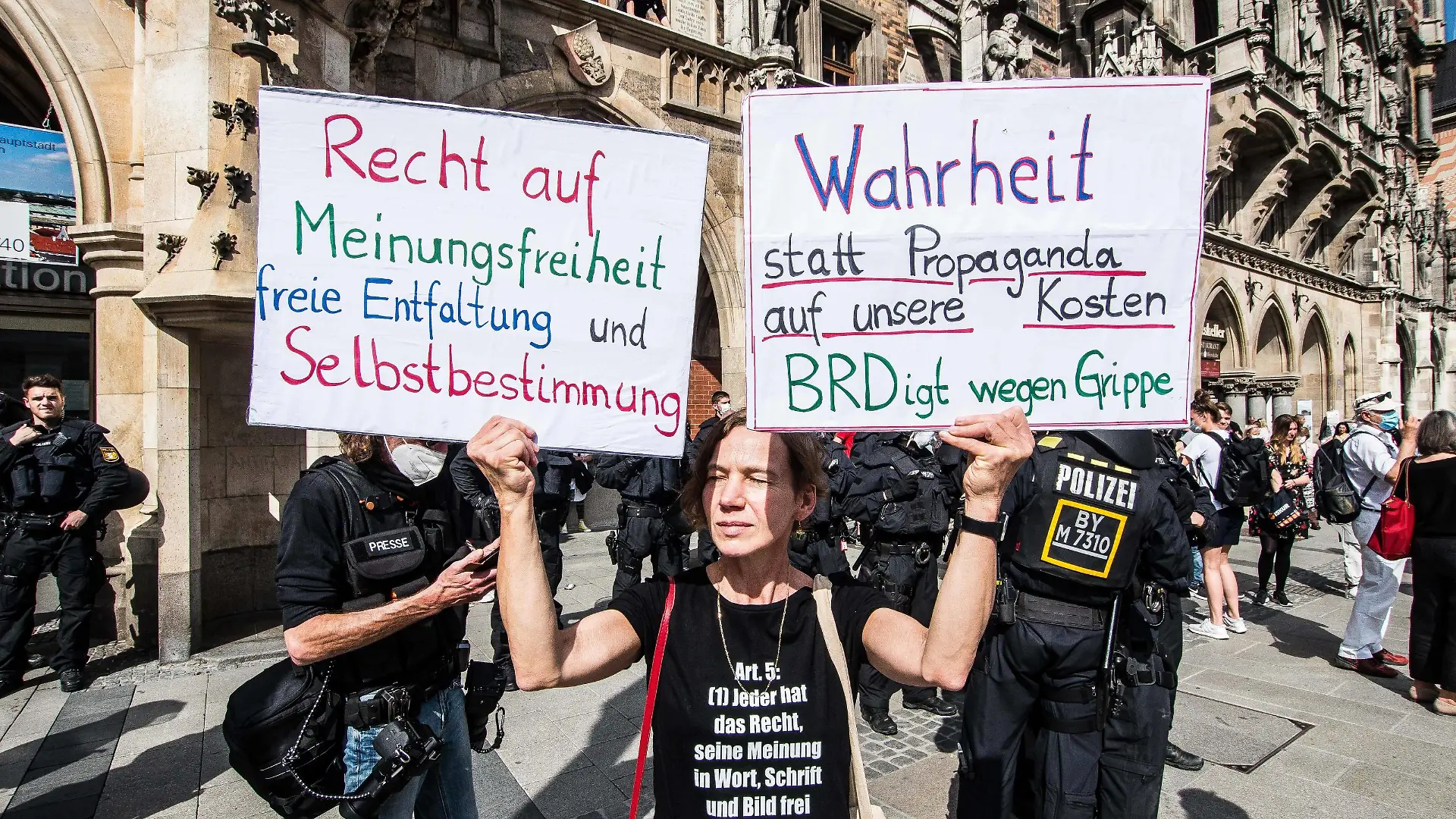 May 9, 2020, Munich, Bavaria, Germany: Despite ongoing relaxing measures, a Querfront cross-front mixture of 3,000 conspiracy theorists, QAnon followers, left-extremists, right-extremists, and Widerstand2020 assembled for a third weekend in Munich s city center, primarily at Marienplatz, to demonstrate for restoration of the Grundgesetz amid the Coronavirus crisis. Such demos and daily mini-demos with an overwhelming 2015-2016 Pegida quality are being staged throughout Germany, with two attacks on journalists for ARD and ZDF having taken place. Internally, members of the official Munich chat group have been planning attacks on journalists for the past week, with many of the more active members coming from right-extremist and neonazi circles and designating all journalists as oeantifa. - ZUMAb160 20200509zbpb160104 Copyright: xSachellexBabbarx