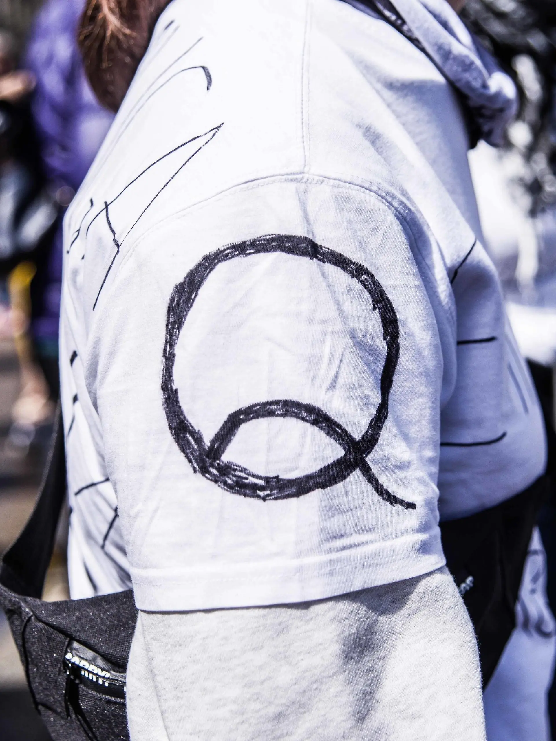 May 2, 2020, Munich, Bavaria, Germany: The QAnon logo at a conspiracy demo in Munich, Germany. On the heels of a violent attack against ZDF journalists in Berlin, the Munich Hygienedemos took place again, complete with conspiracy theorists, right-extremists, neonazis, Hooligans, AfD members, insults and aggression towards journalists and police, and violations of the infection protection laws. Organized in Telegram chats by conspiratorial oeQuerfront cross-front groups, the organizers planned several individual demos with instructions to eventually move to a central location in order to exceed maximum numbers stating oethen police can t do anything. Numerous right-extremists, Verfassungsschutz-monitored figures, QAnon fans, and AfD politicians were in attendance. The groups are of the belief that the a - ZUMAb160 20200502zbpb160048 Copyright: xSachellexBabbarx